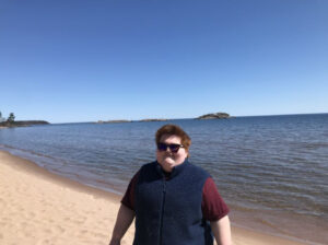 Meg smiling on the beach