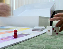 Game board with game piece and dice